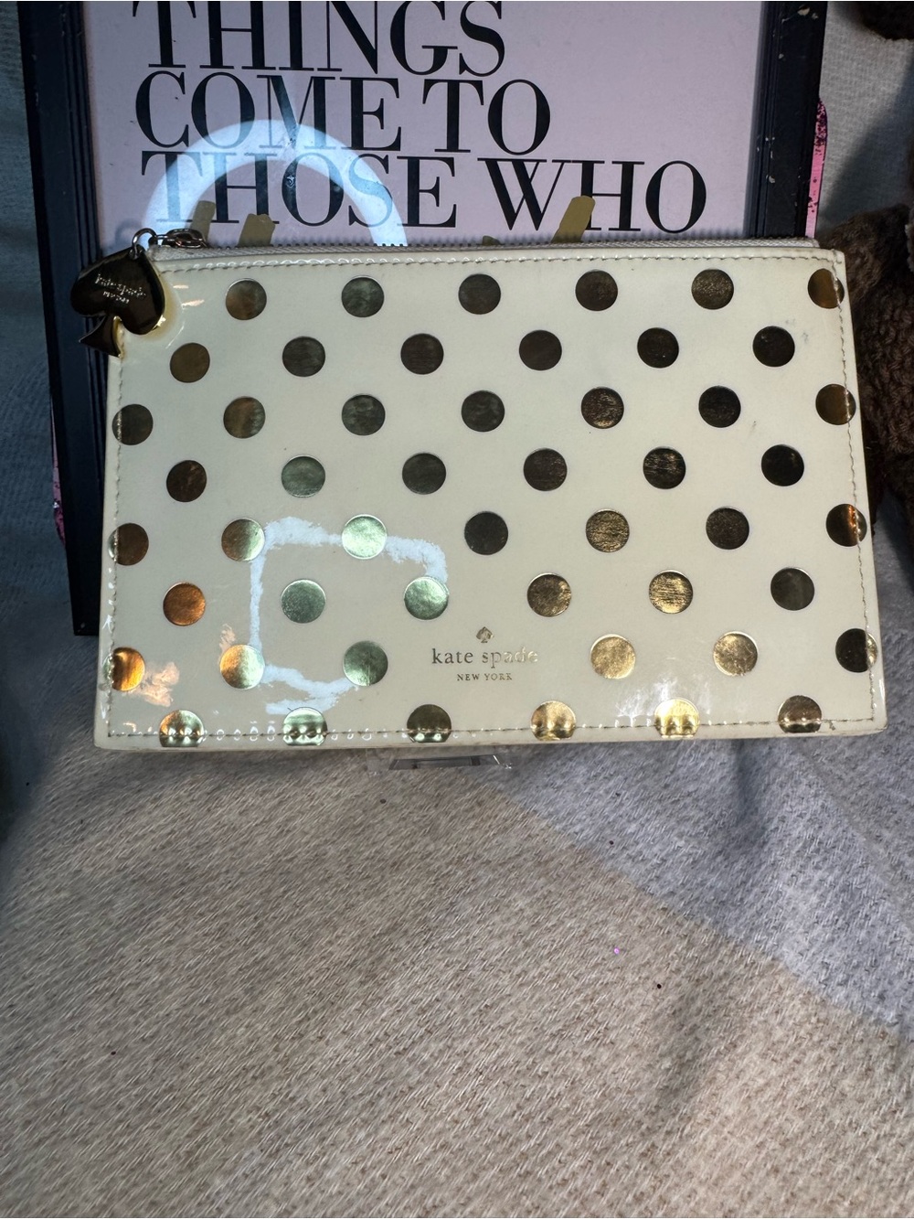 kate spade cream clutch with metallic gold polka dots